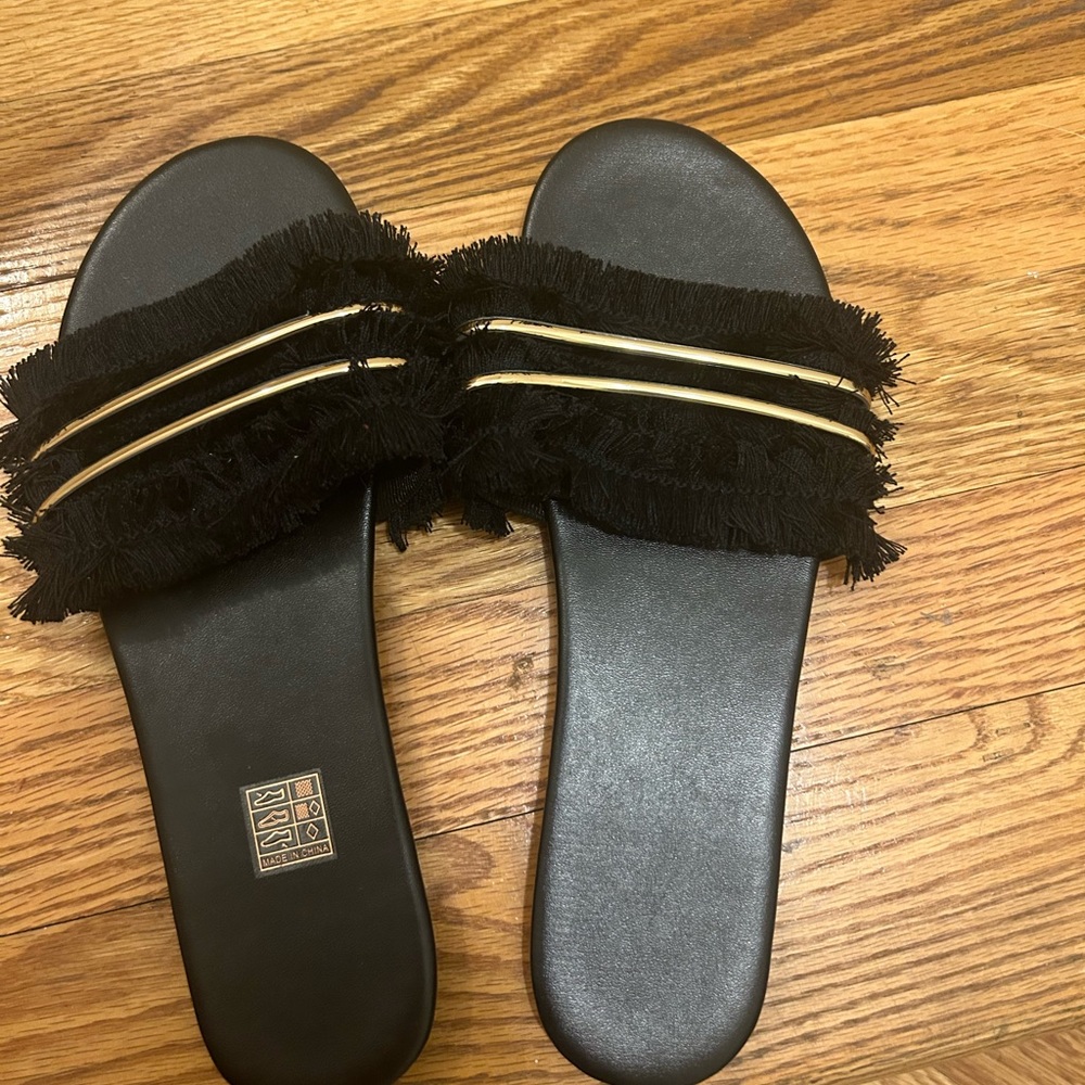 Black slide sandals with gold detail